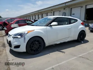 2013 Hyundai Veloster w/Red Int z VIN KMHTC6AD1DU177725, wystawiony jako Copart lot #63909275 z przebiegiem 144 546 mil mil oraz Czysty tytuł • Clean title. Historia ofert i sprzedaży dostępna na DreamBid. Obrazek 1.