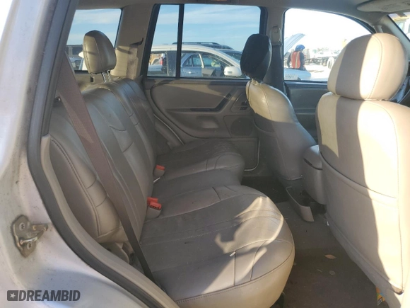 2004 Jeep Grand Cherokee Laredo with VIN 1J4GX48N74C406647, listed as a Copart auction lot 77631654 with 174,824 mi miles and Salvage Title. Bid and sale history available at carsss.com. Image 11.