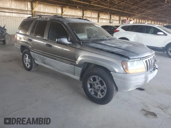 2000 Jeep Grand Cherokee Laredo with VIN 1J4GW48S0YC253091, listed as a Copart auction lot 60357255 with 218,410 mi miles and Clean title. Bid and sale history available at DreamBid. Image 4.
