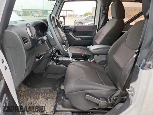 2016 Jeep Wrangler Black Bear with VIN 1C4AJWAG0GL104173, listed as a Copart auction lot 63565415 with 52,922 mi miles and Salvage title. Bid and sale history available at DreamBid. Image 7.