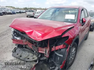 2016 Mazda CX-5 Sport with VIN JM3KE2BY9G0911535, listed as a IAAI auction lot 41906402 with 134,477 mi miles. Bid and sale history available at carsss.com. Image 2.