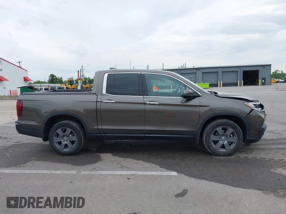 2020 Honda Ridgeline RTL-E with VIN 5FPYK3F78LB001882, listed as a IAAI auction lot 42352980 with 63,278 mi miles and . Bid and sale history available at DreamBid. Image 14.