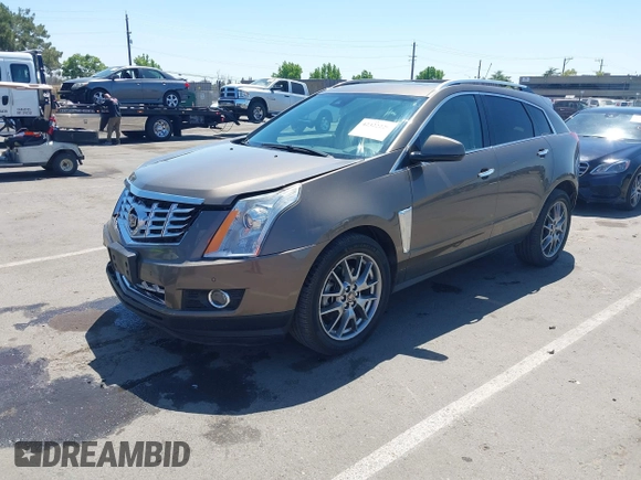2015 Cadillac SRX Performance Collection with VIN 3GYFNFE35FS569682, listed as a IAAI auction lot 42322229 with 124,365 mi miles and . Bid and sale history available at DreamBid. Image 2.