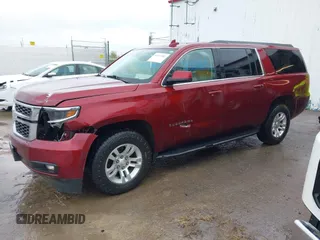 2020 Chevrolet Suburban LT with VIN 1GNSKHKC9LR233603, listed as a IAAI auction lot 41311582 with 104,754 mi miles. Bid and sale history available at carsss.com. Image 2.