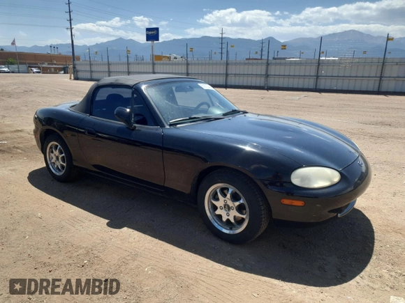 1999 Mazda MX-5 Miata with VIN JM1NB3535X0119662, listed as a Copart auction lot 61870445 with 84,787 mi miles and Clean title. Bid and sale history available at DreamBid. Image 4.