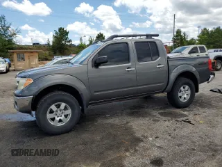 2008 Nissan Frontier SE with VIN 1N6AD07UX8C406795, listed as a Copart auction lot 61303185 with 145,742 mi miles and Salvage title. Bid and sale history available at DreamBid. Image 1.