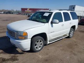 2004 GMC Yukon Denali with VIN 1GKEK63U54J251781, listed as a IAAI auction lot 42099768 with 166,543 mi miles. Bid and sale history available at carsss.com. Image 2.