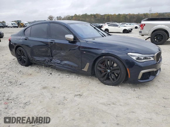 2019 BMW 7 Series M760i xDrive with VIN WBA7H6C51KG615276, listed as a Copart auction lot 79597234 with 39,195 mi miles and Salvage Title. Bid and sale history available at carsss.com. Image 4.