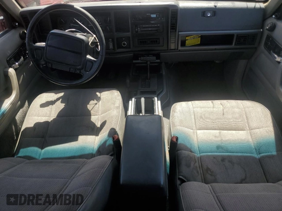 1996 Jeep Cherokee Sport with VIN 1J4FJ68S6TL213886, listed as a Copart auction lot 51462275 with 215,091 mi miles and Salvage title. Bid and sale history available at DreamBid. Image 8.