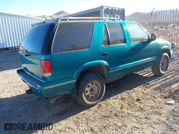 1996 GMC Jimmy SL z VIN 1GKDT13W6T2505181, wystawiony jako IAAI lot #41392669 z przebiegiem 213 728 mil mil oraz . Historia ofert i sprzedaży dostępna na DreamBid. Obrazek 4.