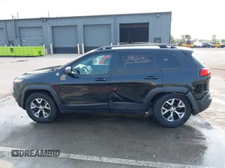 2015 Jeep Cherokee Trailhawk with VIN 1C4PJMBS6FW786622, listed as a IAAI auction lot 42403215 with 148,205 mi miles and . Bid and sale history available at DreamBid. Image 14.