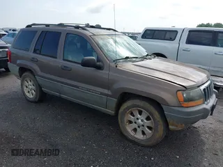 2001 Jeep Grand Cherokee Laredo z VIN 1J4GX48N51C548958, wystawiony jako IAAI lot #42460303 z przebiegiem 210 379 mil mil oraz . Historia ofert i sprzedaży dostępna na DreamBid. Obrazek 1.