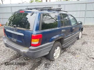 2003 Jeep Grand Cherokee Laredo z VIN 1J4GW48S73C553686, wystawiony jako IAAI lot #42278695 z przebiegiem 154 374 mil mil oraz . Historia ofert i sprzedaży dostępna na DreamBid. Obrazek 4.
