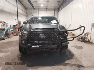 2019 Toyota Tacoma SR with VIN 5TFCZ5AN7KX208672, listed as a IAAI auction lot 42143071 with 83,584 mi miles and . Bid and sale history available at DreamBid. Image 13.
