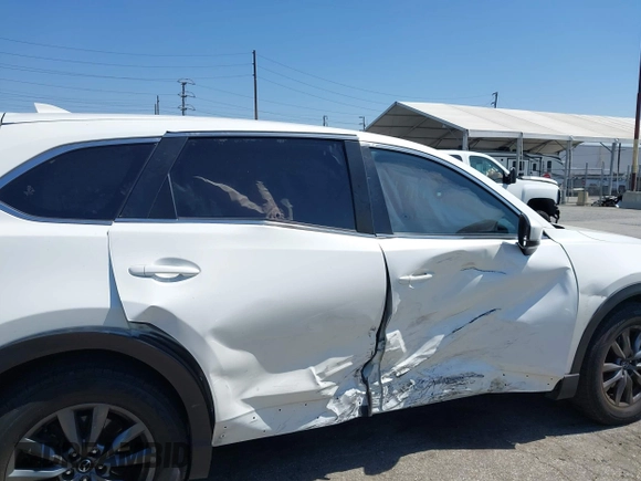 2020 Mazda CX-9 Sport with VIN JM3TCABY1L0406720, listed as a IAAI auction lot 42304144 with 75,887 mi miles and . Bid and sale history available at DreamBid. Image 6.