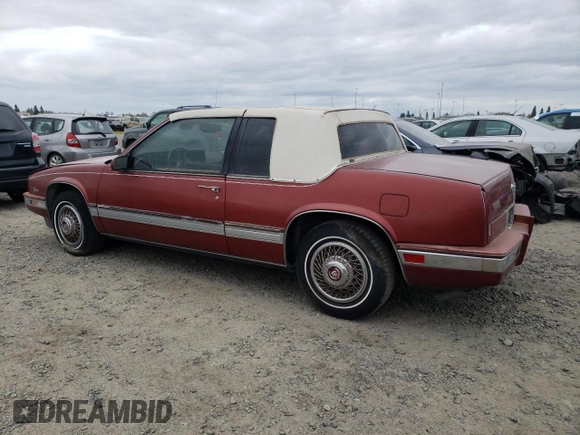 1986 Cadillac Eldorado z VIN 1G6EL5784GU616263, wystawiony jako Copart lot #48741325 z przebiegiem 59 213 mil mil oraz Tytuł czysty. Historia ofert i sprzedaży dostępna na DreamBid. Obrazek 2.