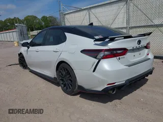 2022 Toyota Camry TRD with VIN 4T1KZ1AK6NU069341, listed as a IAAI auction lot 41881252 with 55,871 mi miles and . Bid and sale history available at DreamBid. Image 3.