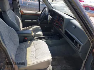 1995 Jeep Cherokee Country z VIN 1J4FJ78S9SL666002, wystawiony jako IAAI lot #42313644 z przebiegiem 226 914 mil mil oraz . Historia ofert i sprzedaży dostępna na DreamBid. Obrazek 5.