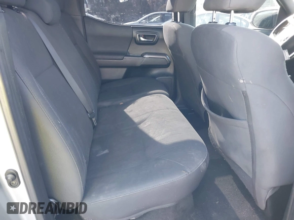 2018 Toyota Tacoma SR with VIN 3TMCZ5AN6JM185891, listed as a IAAI auction lot 41450665 with 53,749 mi miles and . Bid and sale history available at DreamBid. Image 8.