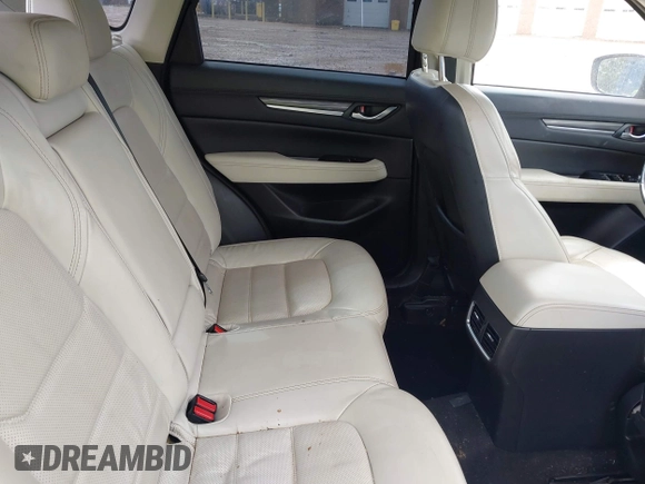 2018 Mazda CX-5 Grand Touring z VIN JM3KFADM8J1406007, wystawiony jako IAAI lot #42008567 z przebiegiem 110 661 mil mil oraz . Historia ofert i sprzedaży dostępna na DreamBid. Obrazek 8.