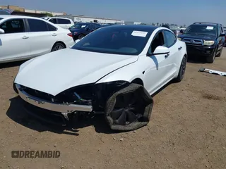 2023 Tesla Model S with VIN 5YJSA1E51PF499919, listed as a IAAI auction lot 42459166 with 6,612 mi miles and . Bid and sale history available at DreamBid. Image 20.