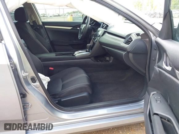 2019 Honda Civic LX with VIN 19XFC2F60KE043806, listed as a IAAI auction lot 41915894 with 123,141 mi miles and . Bid and sale history available at DreamBid. Image 5.