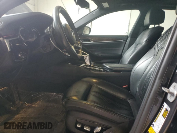 2018 BMW 5 Series M550i xDrive with VIN WBAJB9C58JB035267, listed as a Copart auction lot 64616605 with 125,365 mi miles and Clean title. Bid and sale history available at DreamBid. Image 7.