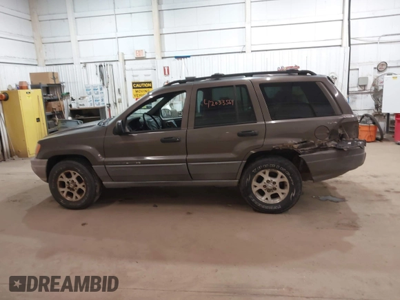 2000 Jeep Grand Cherokee Laredo z VIN 1J4GW48S1YC277710, wystawiony jako IAAI lot #42033564 z przebiegiem Nie podano mil oraz . Historia ofert i sprzedaży dostępna na DreamBid. Obrazek 14.
