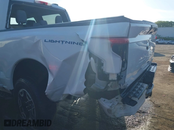 2023 Ford F-150 Lightning Pro with VIN 1FTVW1EL6PWG34059, listed as a IAAI auction lot 42010900 with 20,759 mi miles and . Bid and sale history available at DreamBid. Image 6.