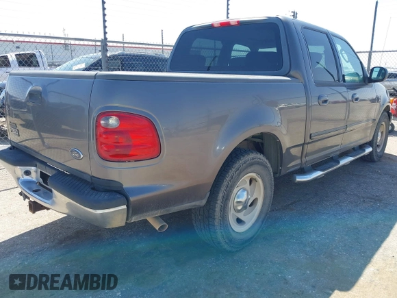 2003 Ford F-150 XLT with VIN 1FTRW07L63KA65904, listed as a IAAI auction lot 41983556 with 166,086 mi miles. Bid and sale history available at carsss.com. Image 4.