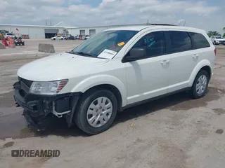 2013 Dodge Journey SE z VIN 3C4PDCAB1DT715883, wystawiony jako IAAI lot #42188089 z przebiegiem 111 905 mil mil oraz . Historia ofert i sprzedaży dostępna na DreamBid. Obrazek 2.