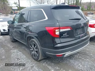 2019 Honda Pilot Touring 7-Passenger z VIN 5FNYF5H66KB027960, wystawiony jako IAAI lot #41863212 z przebiegiem 114 615 mil mil oraz . Historia ofert i sprzedaży dostępna na DreamBid. Obrazek 3.