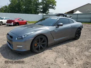 2009 Nissan GT-R Premium z VIN JN1AR54F09M251146, wystawiony jako Copart lot #68059054 z przebiegiem 16 498 mil mil oraz Szkody całkowita. Historia ofert i sprzedaży dostępna na DreamBid. Obrazek 1.