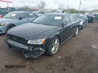 2016 Audi A8 L 4.0T Sport with VIN WAU43AFD3GN020763, listed as a IAAI auction lot 41951858 with 104,563 mi miles. Bid and sale history available at carsss.com. Image 2.