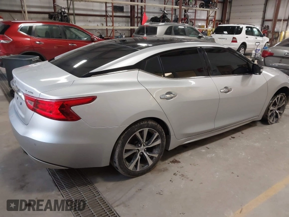 2016 Nissan Maxima SL with VIN 1N4AA6AP6GC384851, listed as a IAAI auction lot 41663659 with 127,247 mi miles and . Bid and sale history available at DreamBid. Image 4.
