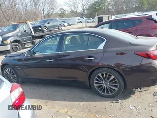 2019 Infiniti Q50 3.0t LUXE with VIN JN1EV7AP9KM512446, listed as a IAAI auction lot 41311730 with 105,000 mi miles. Bid and sale history available at carsss.com. Image 13.