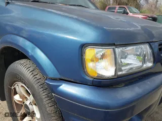 2002 Isuzu Rodeo S with VIN 4S2CK58W124320988, listed as a IAAI auction lot 41921874 with 227,320 mi miles. Bid and sale history available at carsss.com. Image 15.