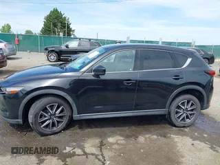 2018 Mazda CX-5 Grand Touring z VIN JM3KFBDM5J0307785, wystawiony jako IAAI lot #42302609 z przebiegiem 81 974 mil mil oraz . Historia ofert i sprzedaży dostępna na DreamBid. Obrazek 15.