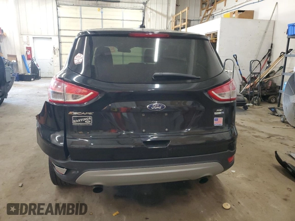 2016 Ford Escape SE z VIN 1FMCU9GXXGUA99014, wystawiony jako Copart lot #56494855 z przebiegiem 37 883 mil mil oraz Szkoda całkowita • Salvage title. Historia ofert i sprzedaży dostępna na DreamBid. Obrazek 6.