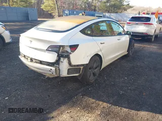 2018 Tesla Model 3 Long Range Battery with VIN 5YJ3E1EA0JF153146, listed as a IAAI auction lot 41621919 with 76,794 mi miles and . Bid and sale history available at DreamBid. Image 4.