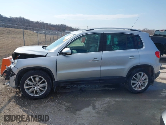 2011 Volkswagen Tiguan SE with VIN WVGBV7AX2BW562055, listed as a IAAI auction lot 41642084 with 175,407 mi miles and . Bid and sale history available at DreamBid. Image 14.