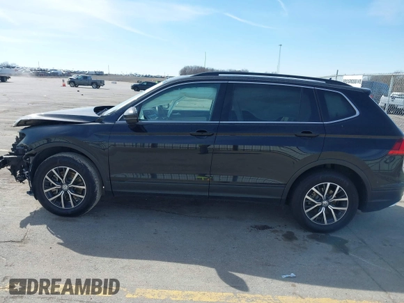 2019 Volkswagen Tiguan SE with VIN 3VV2B7AX6KM066013, listed as a IAAI auction lot 41854035 with 72,322 mi miles and . Bid and sale history available at DreamBid. Image 14.