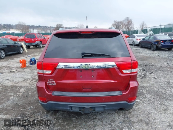 2012 Jeep Grand Cherokee Laredo with VIN 1C4RJFAG7CC221682, listed as a IAAI auction lot 41881922 with 218,762 mi miles. Bid and sale history available at carsss.com. Image 16.