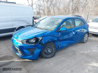 2021 Kia Rio 5-Door S with VIN 3KPA25AD9ME379848, listed as a IAAI auction lot 41335052 with 52,917 mi miles. Bid and sale history available at carsss.com. Image 2.