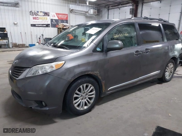 2012 Toyota Sienna XLE AAS with VIN 5TDYK3DC9CS268758, listed as a IAAI auction lot 41613513 with 214,601 mi miles. Bid and sale history available at carsss.com. Image 2.