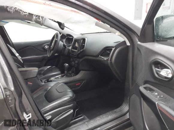 2022 Jeep Cherokee Trailhawk z VIN 1C4PJMBX9ND514703, wystawiony jako IAAI lot #41761037 z przebiegiem 38 499 mil mil oraz . Historia ofert i sprzedaży dostępna na DreamBid. Obrazek 5.