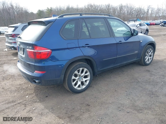 2011 BMW X5 35i with VIN 5UXZV4C56BL412415, listed as a IAAI auction lot 41611847 with 141,848 mi miles. Bid and sale history available at carsss.com. Image 4.