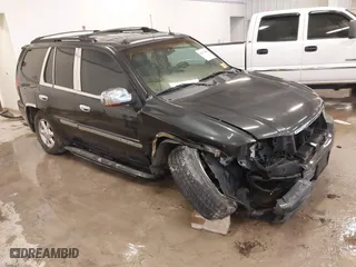 2004 GMC Envoy SLE with VIN 1GKDT13S642381802, listed as a IAAI auction lot 41723854 with 212,283 mi miles. Bid and sale history available at carsss.com. Image 1.