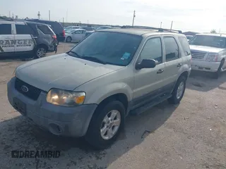 2005 Ford Escape XLT with VIN 1FMYU03145KA40360, listed as a IAAI auction lot 42511276 with 151,269 mi miles and . Bid and sale history available at DreamBid. Image 2.