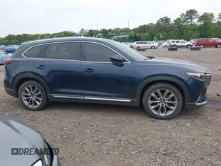 2018 Mazda CX-9 Grand Touring with VIN JM3TCBDY8J0209737, listed as a IAAI auction lot 42374826 with Not provided miles and . Bid and sale history available at DreamBid. Image 12.